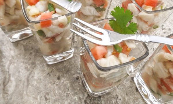 Tilapia Ceviche served in shot glasses.