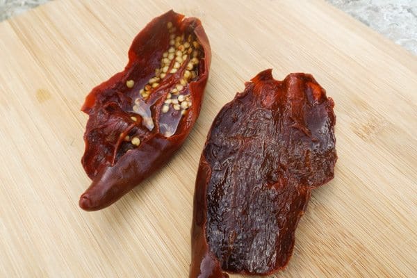 Chile Guajillo pepper on wooden cutting board-Beef Mexican Tamales