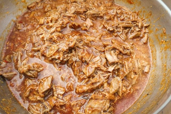 Shredded beef with chile red sauce in a bowl-Beef Mexican Tamales