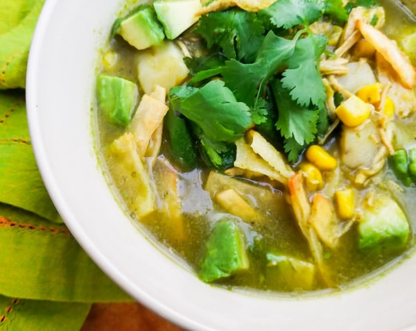 Healthy Chicken Tortilla Soup Recipe served in a white bowl.