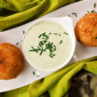 Stuffed Potato Balls, are stuffed with a savory picadillo or beef ground meat and fried leaving a crusty balance and perfectly moist on the inside served with a poblano dipping sauce.