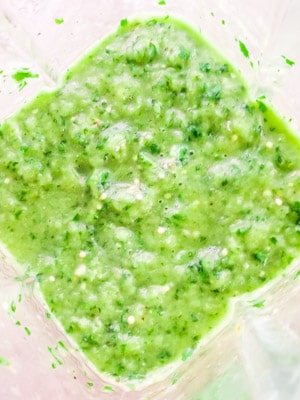 Salsa verde inside a blender.