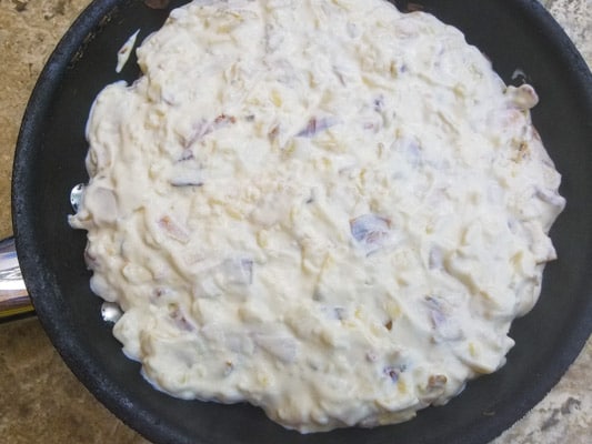 Dip in a skillet and ready to go in the oven-Black Bean Caramelized Onion Bacon Dip