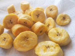 Cooked plantain slices. Drain excess oil off plantain on paper towels.