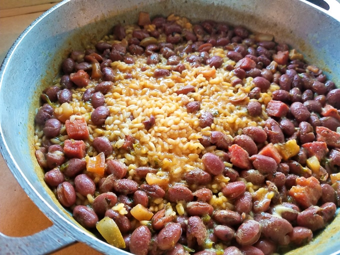 Rice and beans sauteing together for the Puerto Rican Rice and Beans (Arroz y habichuelas).