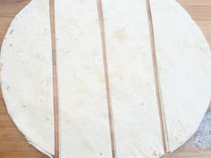 Flour tortillas cut for beef taco ring.