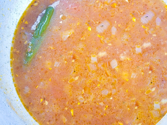 Tomato broth added to pot and cooking for the sopa de fideo.