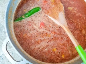 Tomato broth added to pot for the sopa de fideo.