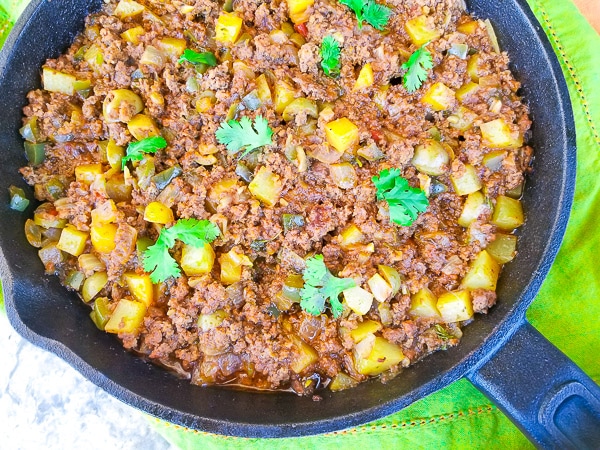Carne Molida (Puerto Rican Picadillo) cooked in a skillet.