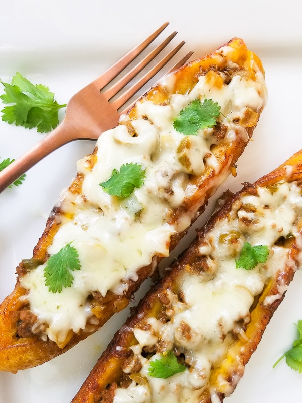 Canoas de Platano (Stuffed Plantains) served on a white platter.