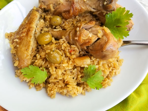 Cooked Puerto Rican Rice with Chicken and served in a large white platter.
