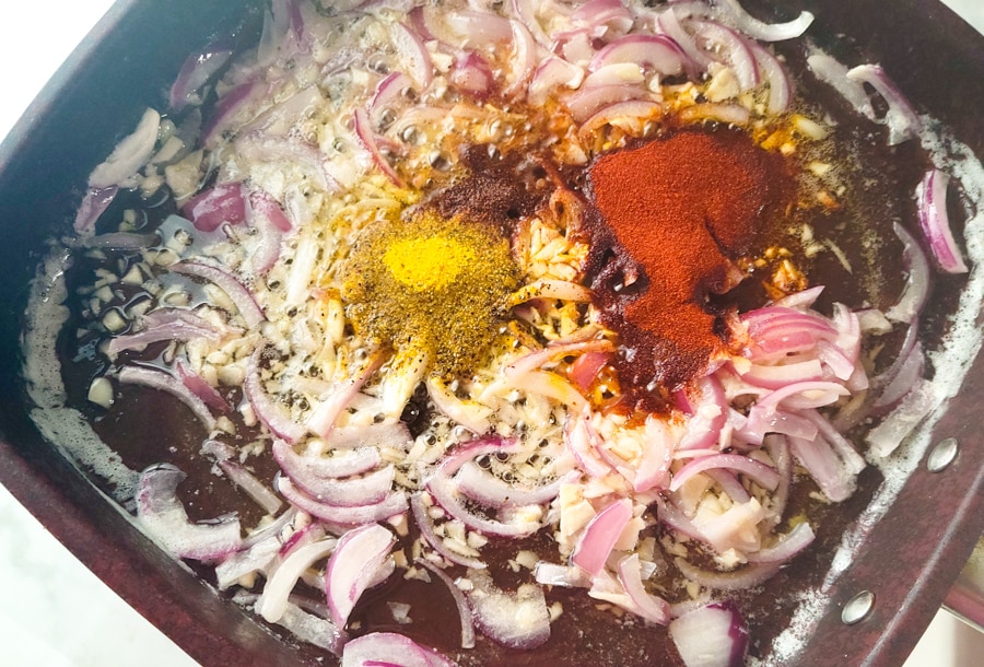 Spices added to the skillet for the camarones a la cucaracha.