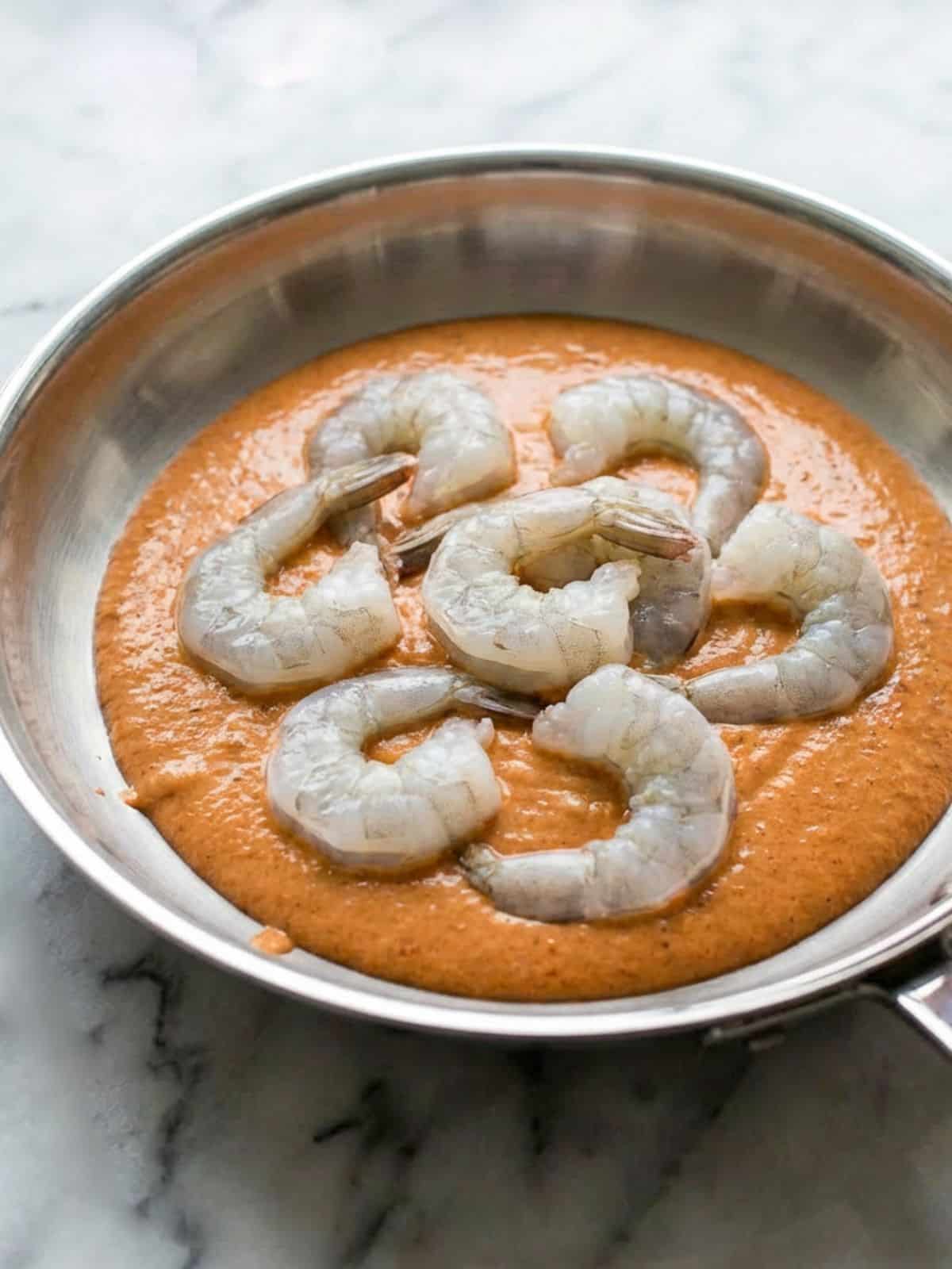 The raw shrimps sitting in the chipotle sauce.