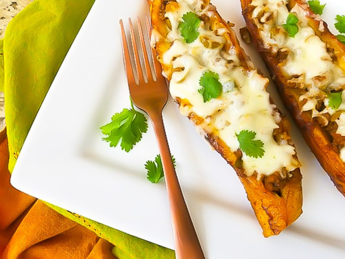 Canoas de Platano (Stuffed Plantains) served on a white platter.