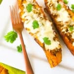 Canoas de Platano (Stuffed Plantains) served on a white platter.