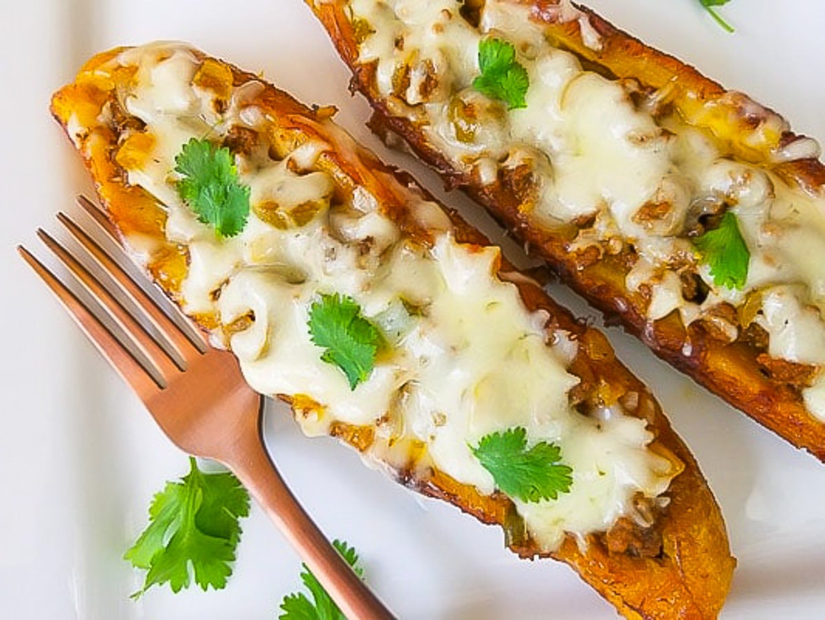 Canoas de Platano (Stuffed Plantains) served on a white platter.
