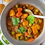 Carne Guisada (Puerto Rican Beef Stew) cooked in a caldero.