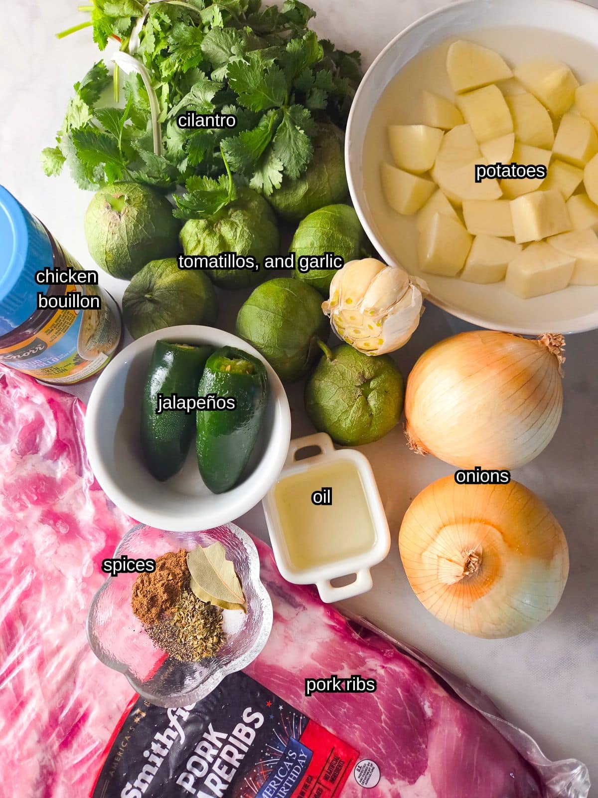 An image showing all the ingredients needed to make costllas en salsa verde.