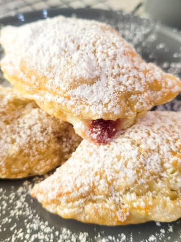 Empanadillas de Guayaba on a gray plate.