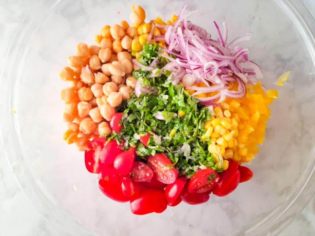 All the ingredients in a glass mixing bowl ready to mix. 