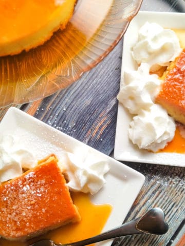 Flan de coco served on a large platter and two individual side servings with whipped cream.
