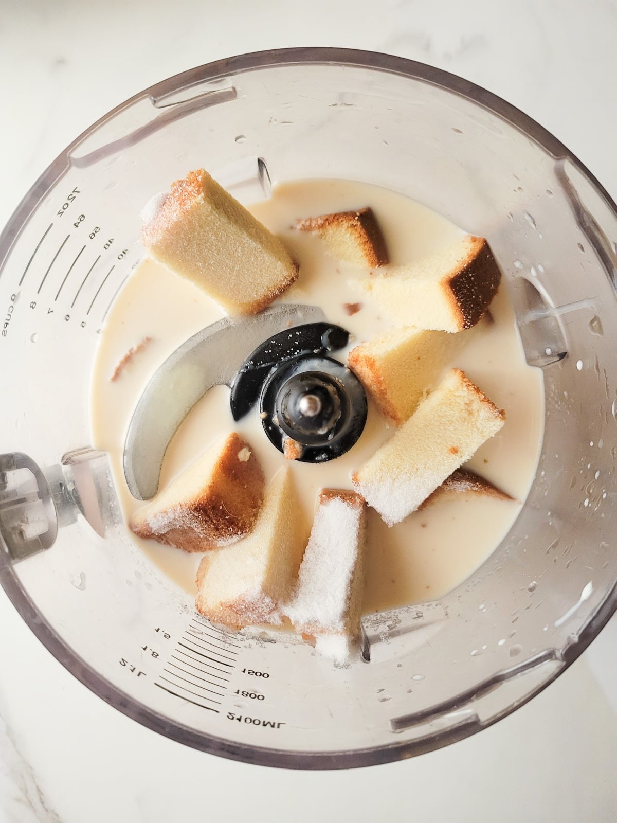 All the ingredients added to a blender.