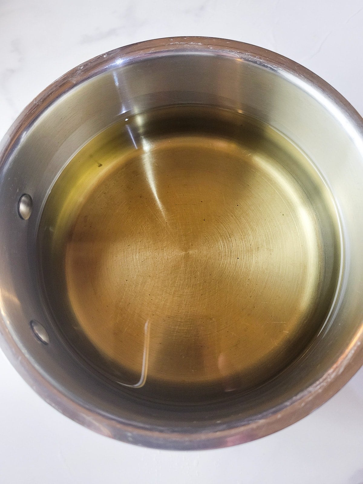 A large saucepan with oil to fry the masitas.