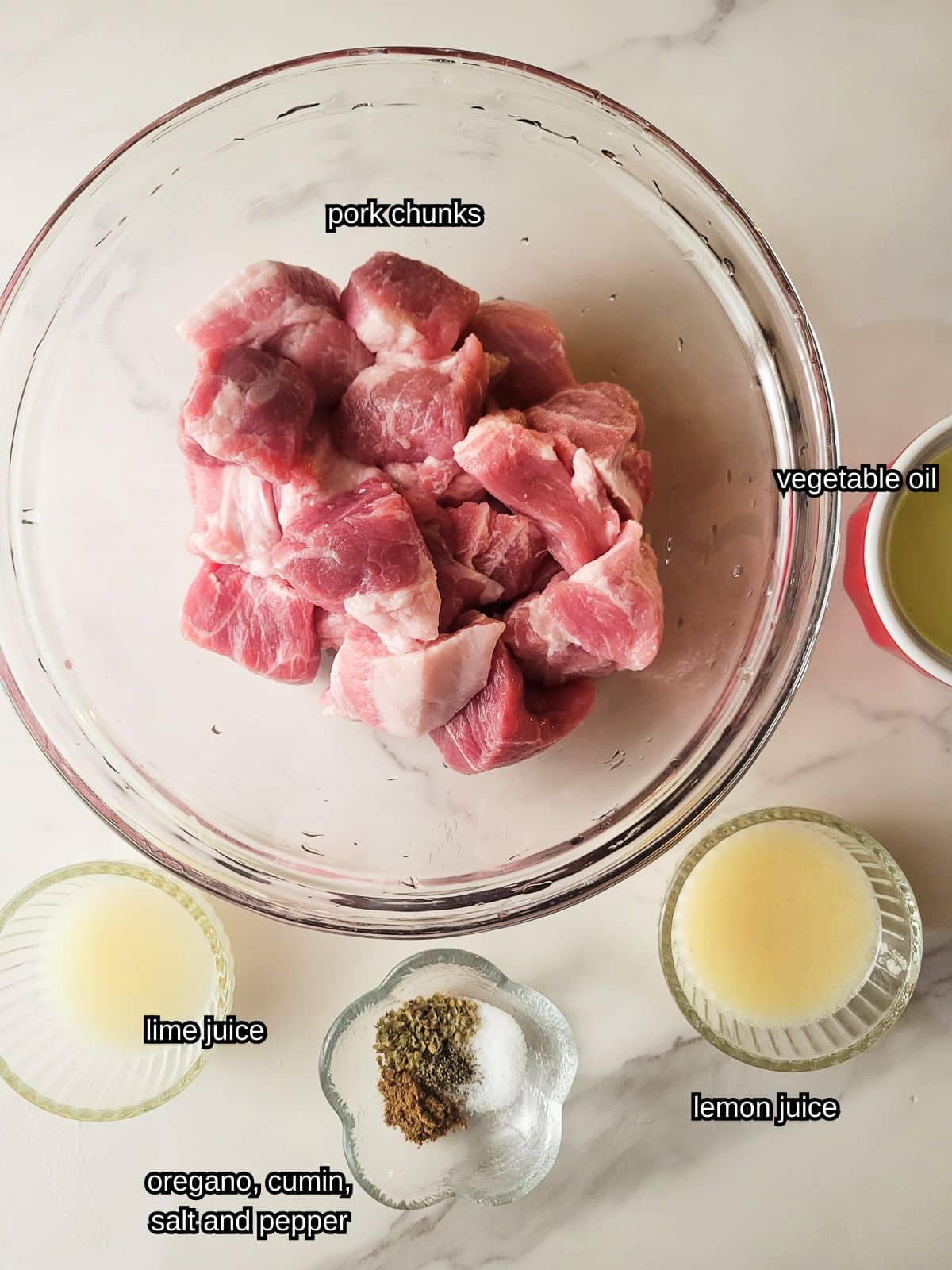 An image showing all the ingredients needed to make Cuban masitas de puerco.