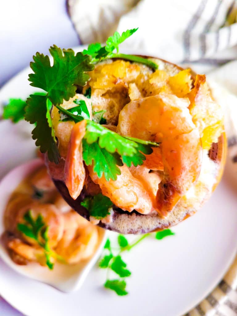 Mofongo de Yuca con Camarones (Mofongo Yuca with Shrimps) served in a pilon (mortar and pestle) with an extra side of garlicky shrimp.