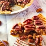 A slice of Pay de Nuez (Pecan Pie) on a dessert plate.