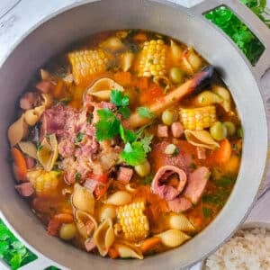 Sopa de Jamon (Puerto Rican Ham soup) cooked in a large caldero with a side of white rice.