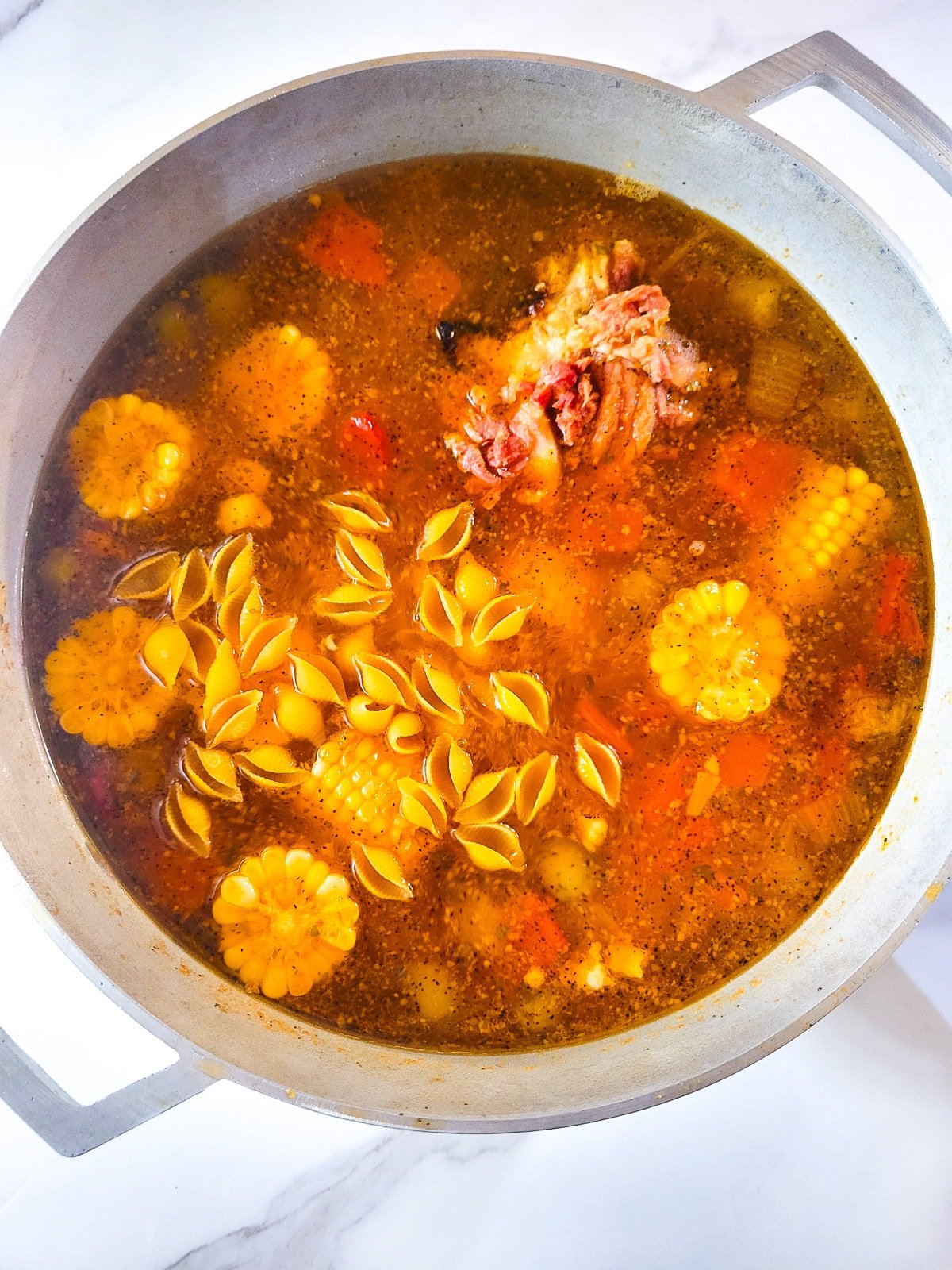 The pasta and cilantro has been added to finish off the Puerto Rican ham soup.