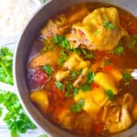 Fully cooked Sudado de Pollo (Colombian Chicken Stew) in pot.