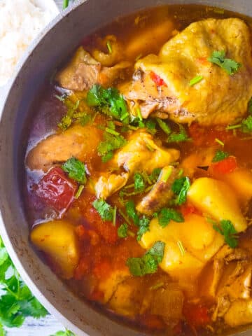 Fully cooked Sudado de Pollo (Colombian Chicken Stew) in pot.