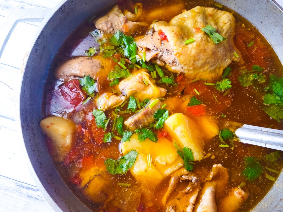 Fully cooked Sudado de Pollo (Colombian Chicken Stew) in pot.
